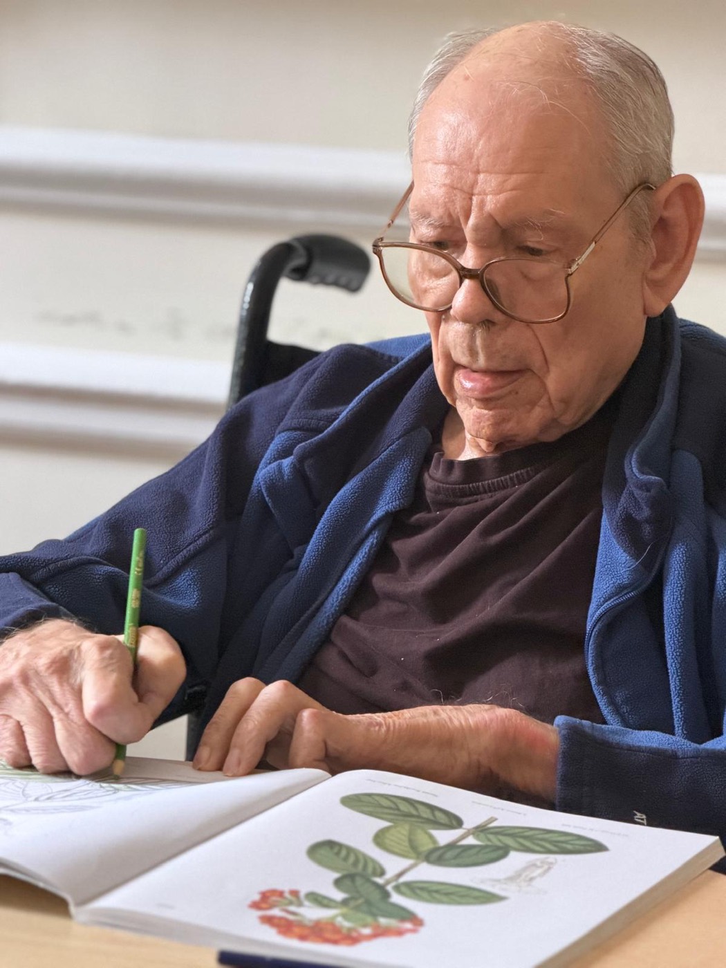 A resident enjoying botanical colouring